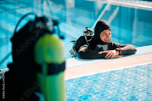 Oxygen tank at the poolside, scuba gear, diving