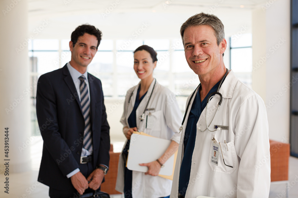 Doctor and businessman shaking hands in meeting Doctor and businessman shaking hands in meeting