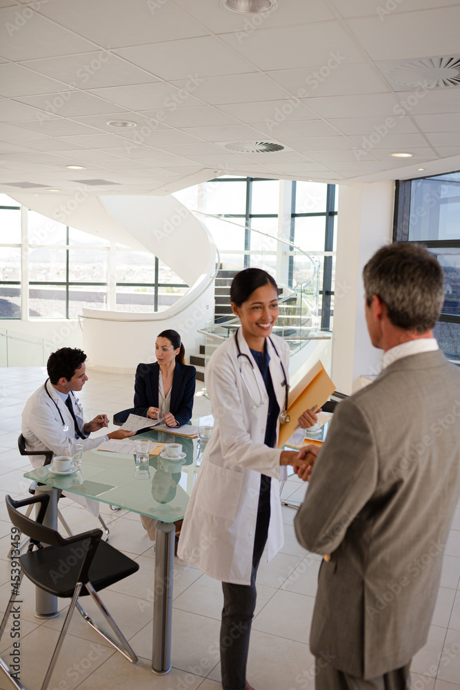 Portrait of smiling doctors and businessman Portrait of smiling doctors and businessman