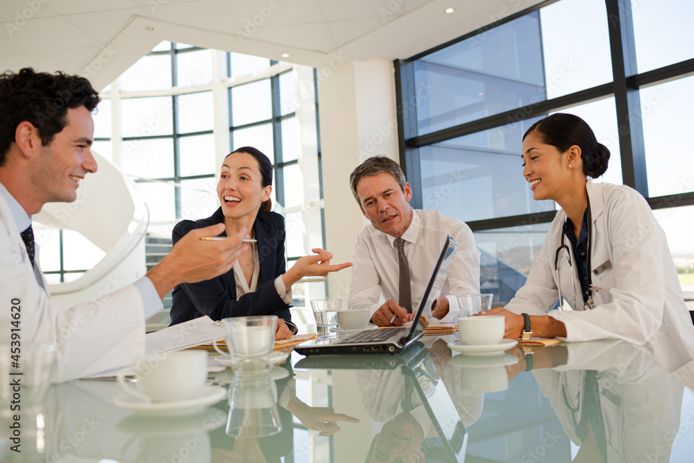 Fototapeta premium Portrait of smiling doctor in hospital corridor