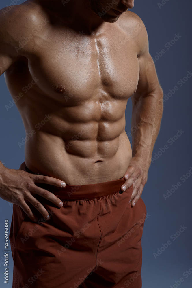 Muscular male athlete, photo shoot in studio Muscular male athlete, photo shoot in studio