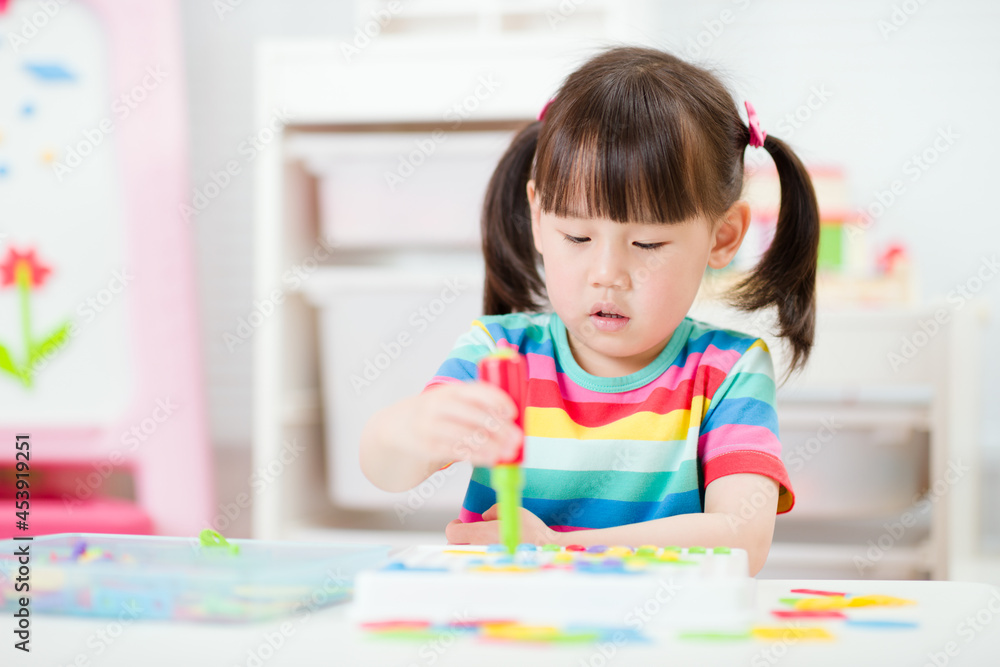 young girl playing creative toy blocks for homeschooling young girl playing creative toy blocks for homeschooling