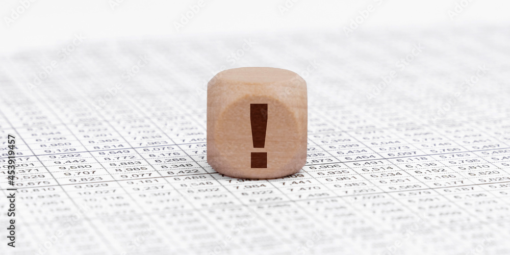 There is a cube with an exclamation mark on the accounting documents.