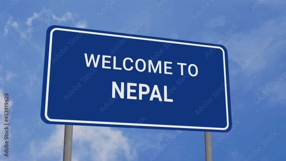 Welcome to Nepal Road Sign on Clear Blue Sky with Rapid Moving Clouds Welcome to Nepal Road Sign on Clear Blue Sky with Rapid Moving Clouds