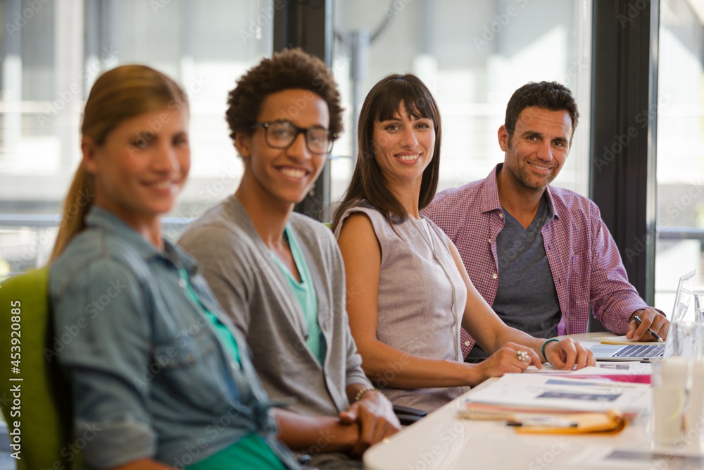 Portrait of business people smiling in meeting Portrait of business people smiling in meeting