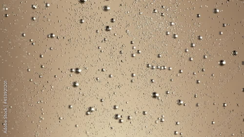 Super slow motion of champagne bubbles texture. Filmed on high speed cinema camera, 1000 fps Super slow motion of champagne bubbles texture. Filmed on high speed cinema camera, 1000 fps