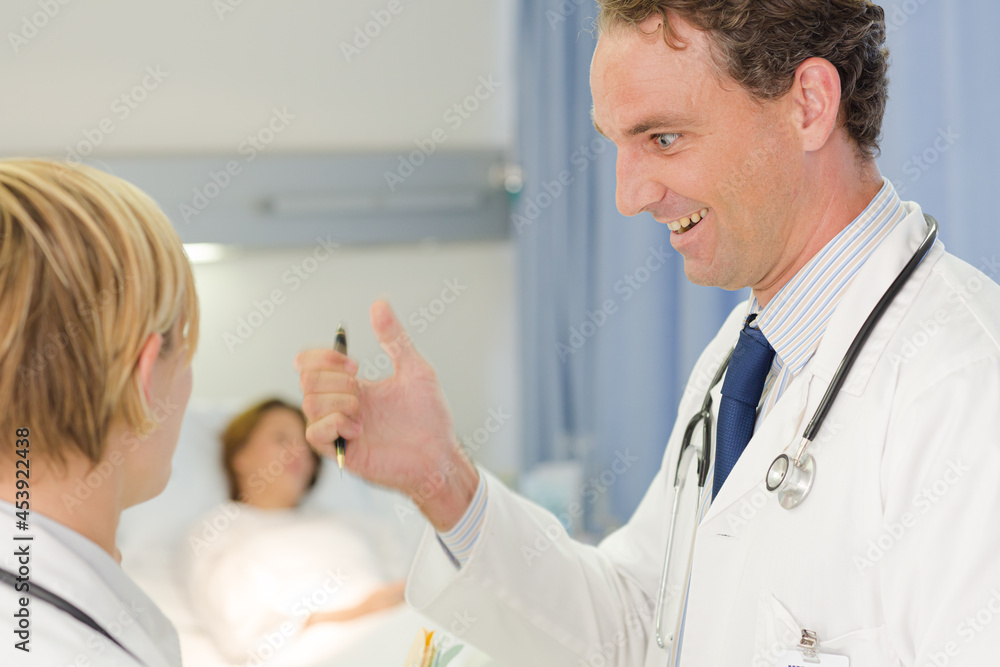 Obraz premium Doctor checking syringe in hospital room