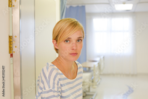 Patient using crutches in hospital room