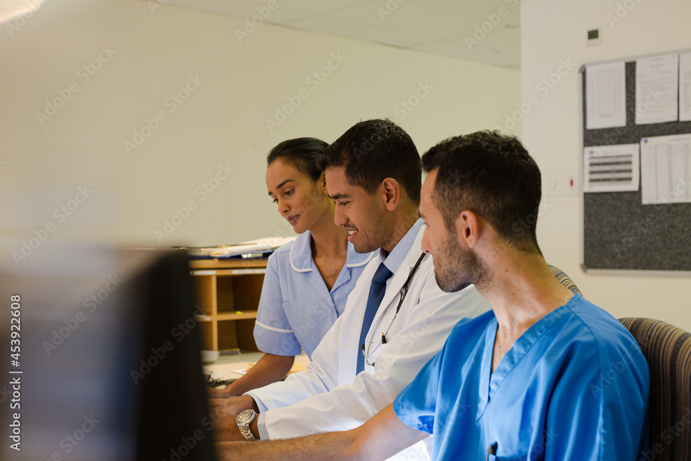 Fototapeta premium Hospital staff talking at front desk
