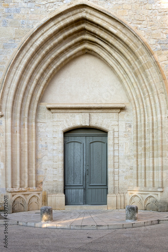 Arched door of Saint Saturnin church in calvisson, Gard, France