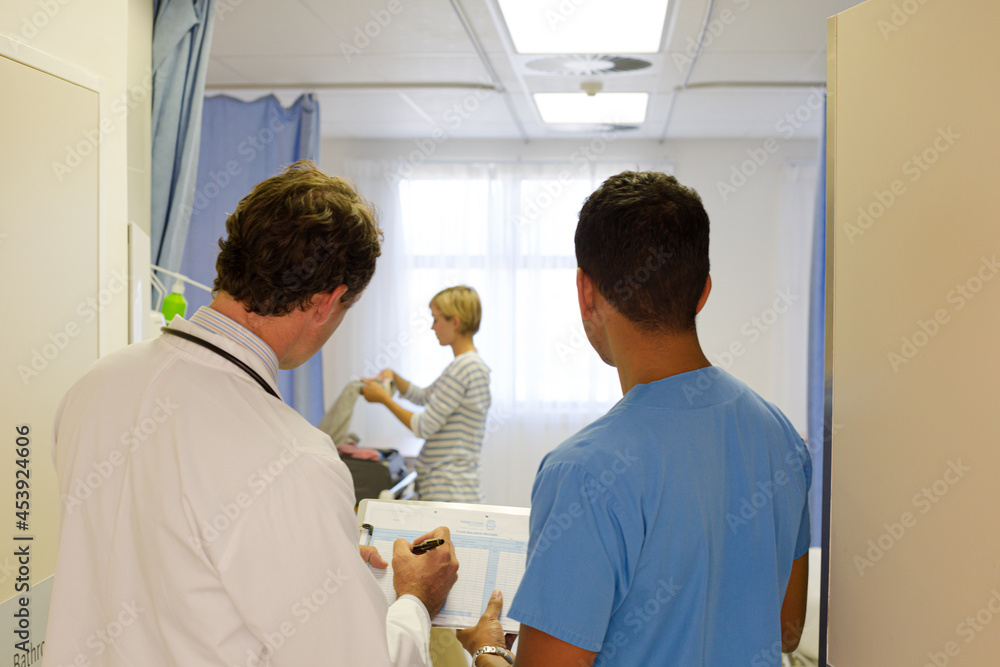 Fototapeta premium Doctors standing in hospital room