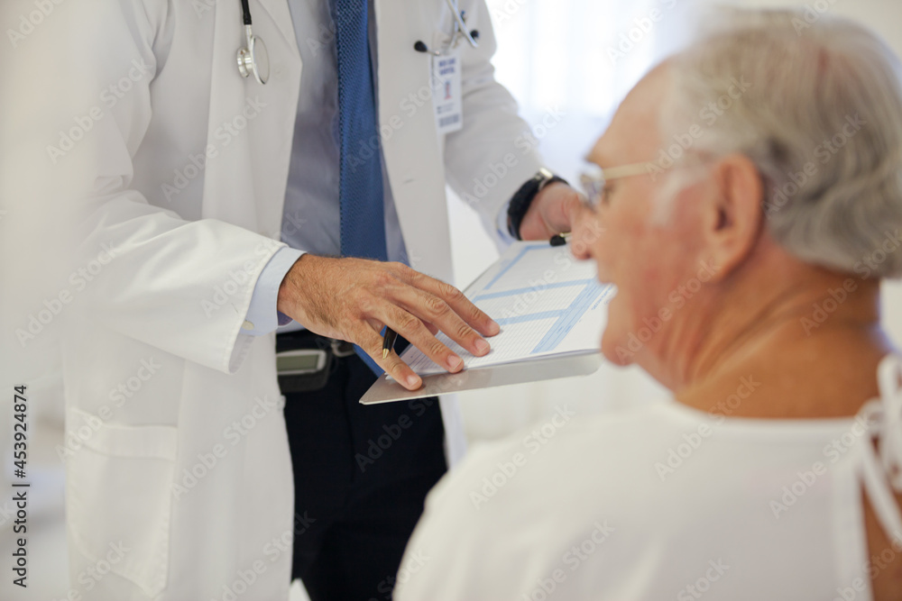 Doctor talking to older patient in hospital Doctor talking to older patient in hospital