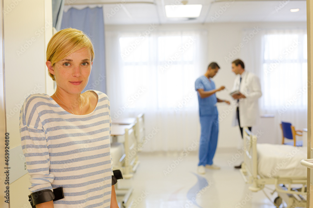 Fototapeta premium Patient using crutches in hospital room
