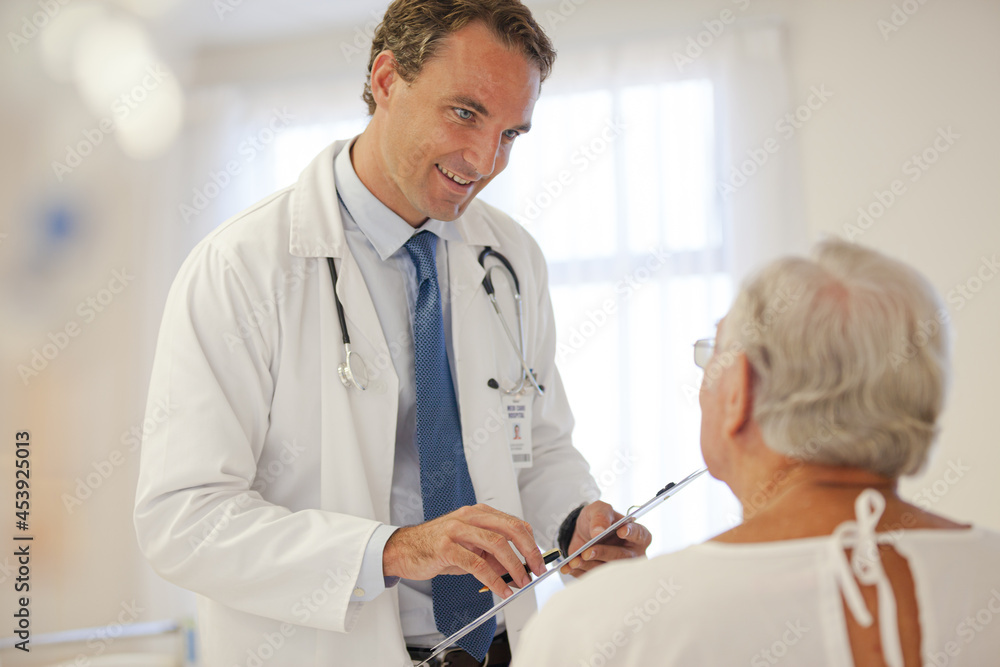 Doctor talking to older patient in hospital Doctor talking to older patient in hospital