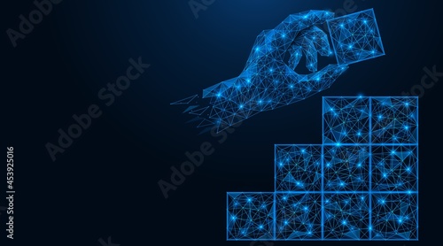 The hand puts the cube. Business plan for revenue growth. Polygonal construction of lines and points. Blue background.