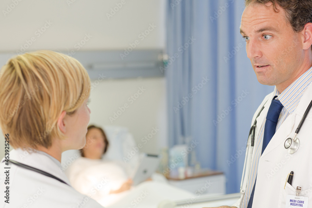Fototapeta premium Doctor checking syringe in hospital room