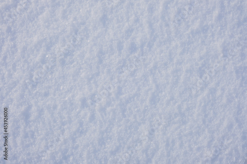 Texture of white snow with frozen ice, background