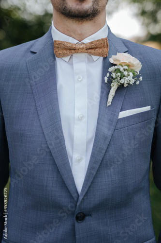 Groom wearing a bow tie on his wedding day close-up