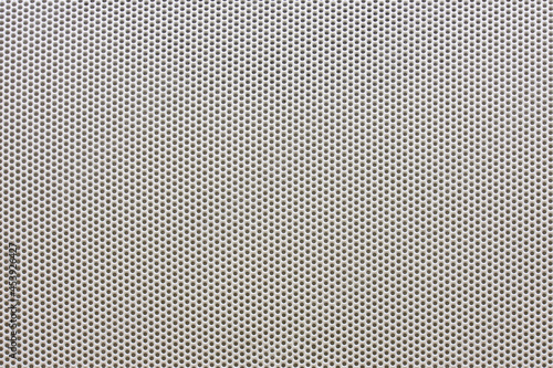 Silver speaker metal mesh texture, background with small holes