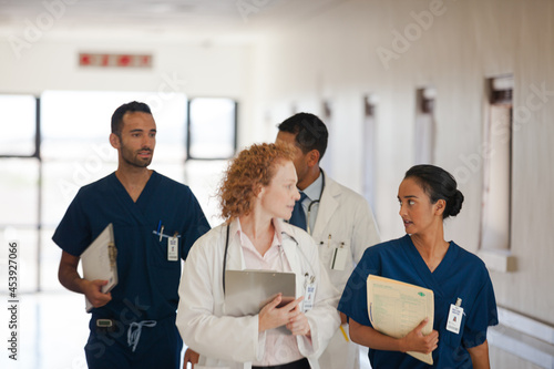 Hospital staff talking in hallway
