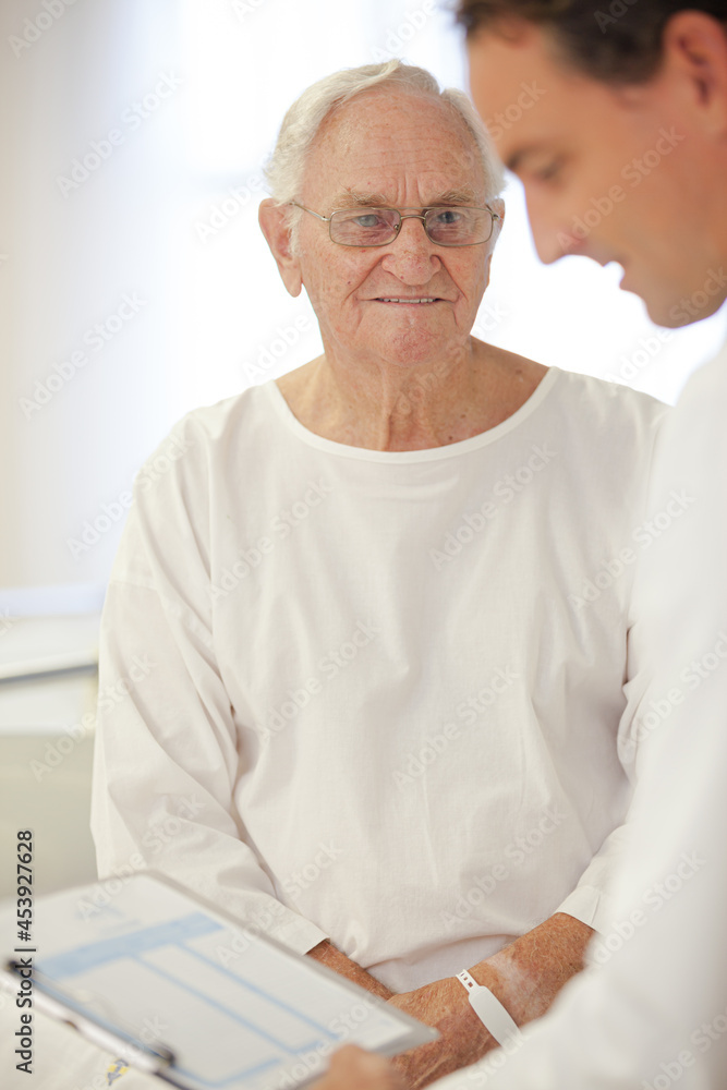 Doctor talking to older patient in hospital Doctor talking to older patient in hospital