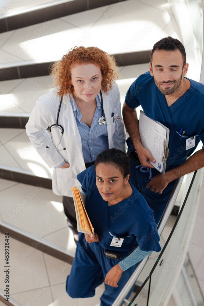 Doctor and nurses on hospital steps Doctor and nurses on hospital steps