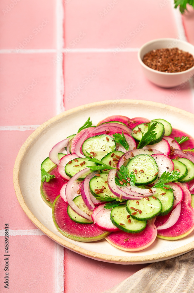 Salad with watermelon radish, cucumber and red onion Salad with watermelon radish, cucumber and red onion