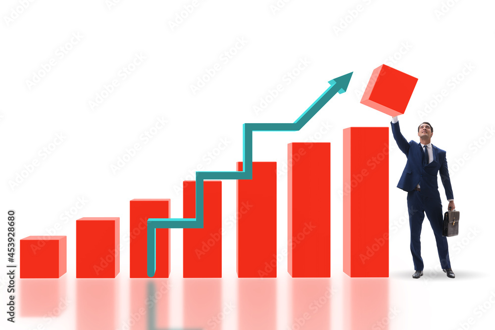 Businessman supporting economic growth on chart Businessman supporting economic growth on chart