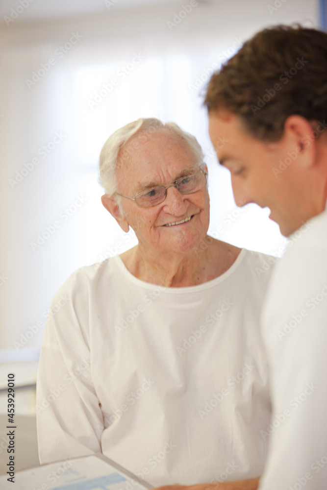 Doctor talking to older patient in hospital Doctor talking to older patient in hospital