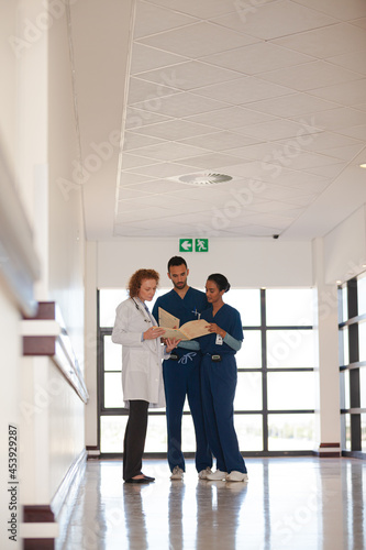 Hospital staff talking in hallway