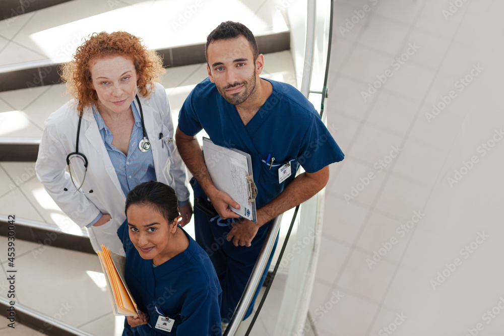 Fototapeta premium Doctor and nurses on hospital steps