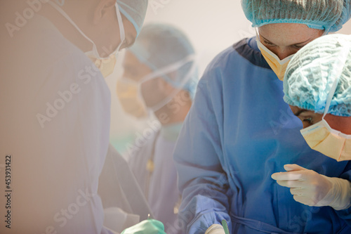 Surgeons working in operating room