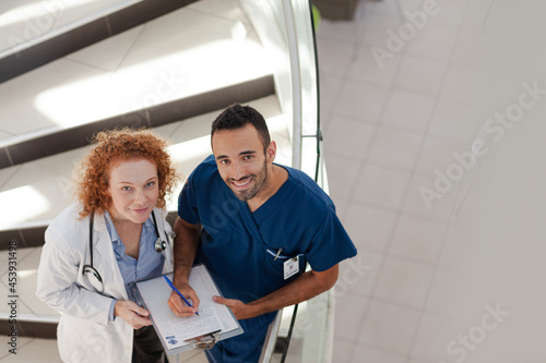 Doctor and nurse on hospital steps