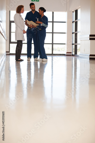 Hospital staff talking in hallway