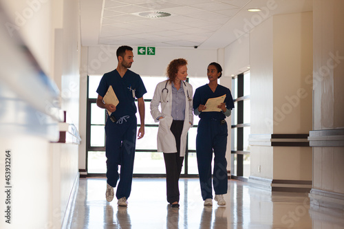 Hospital staff walking in hallway © KOTO