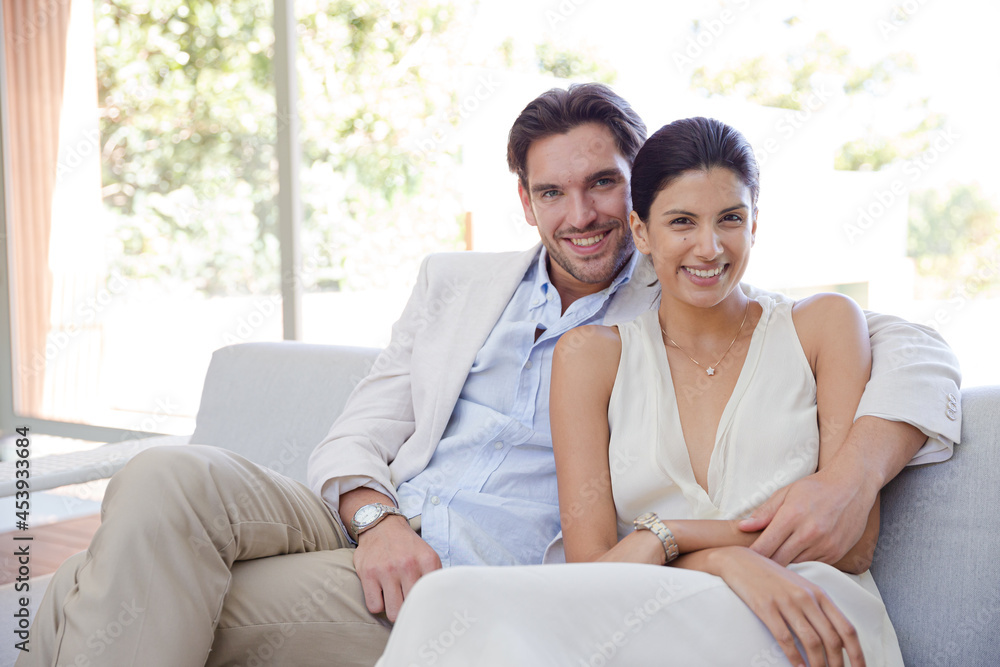 Portrait of smiling couple on sofa Portrait of smiling couple on sofa