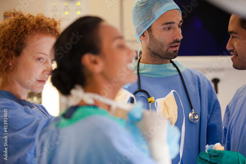 Surgeons talking in operating room