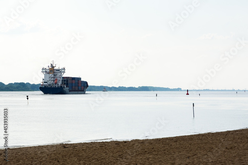 cargo container ship sailing on the river