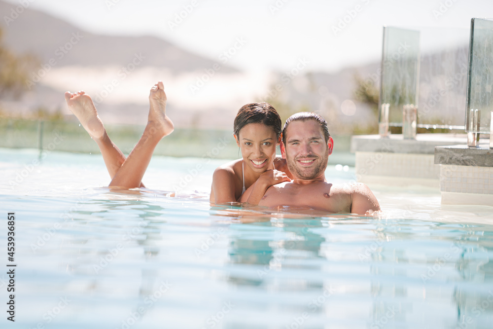 Couple relaxing in swimming pool Couple relaxing in swimming pool
