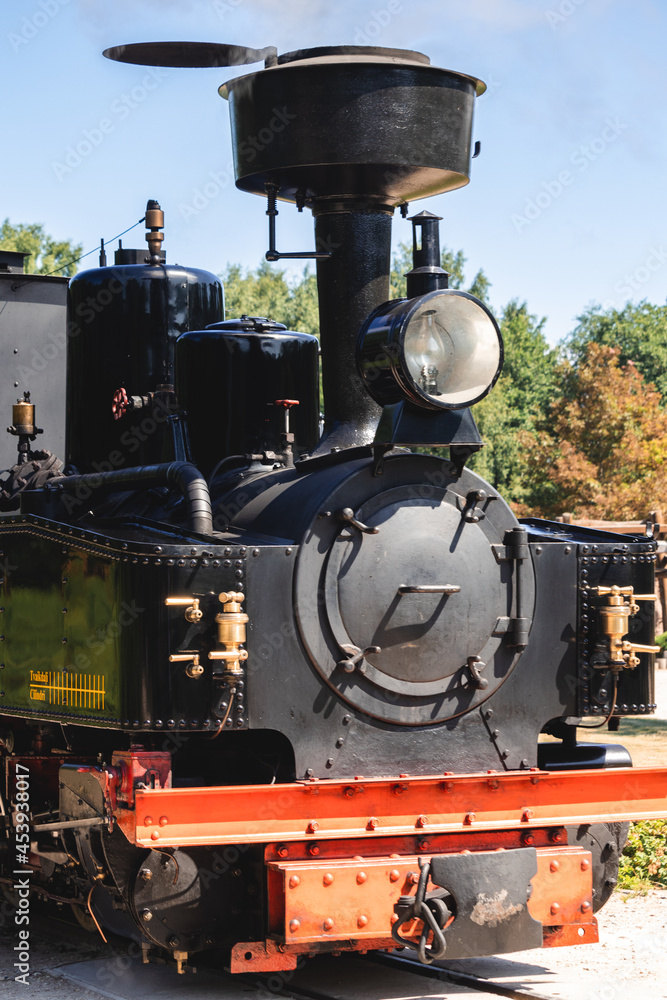 small colorful steam locomotive summer