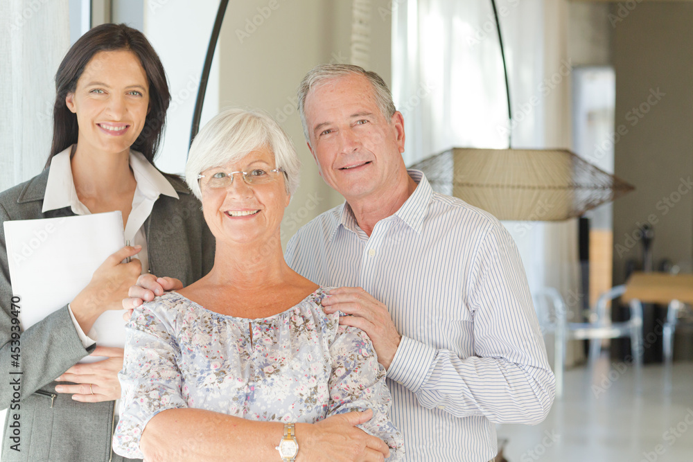 Financial advisor posing with clients Financial advisor posing with clients