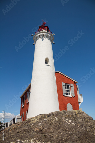 Beautiful Lighthouse. Fisgard Lighthouse in Ford Rodd Hill National Park in Victoria, BC, Canada. photo