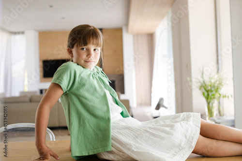 Girl sitting on table