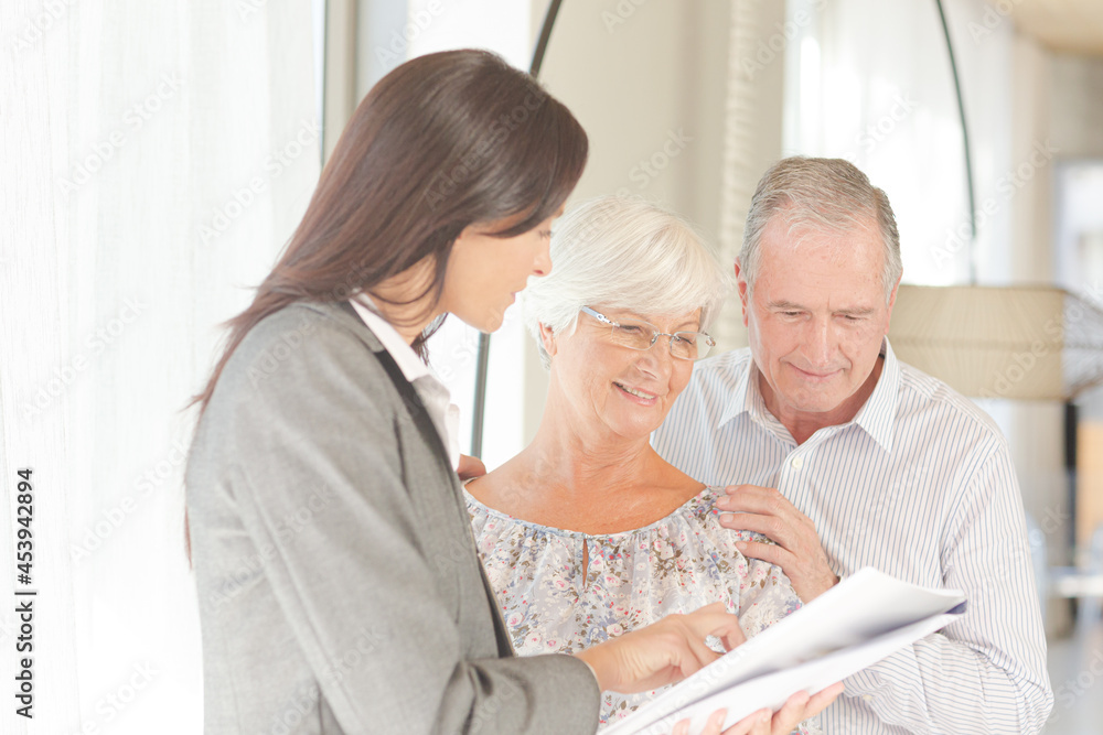 Fototapeta premium Financial advisor posing with clients