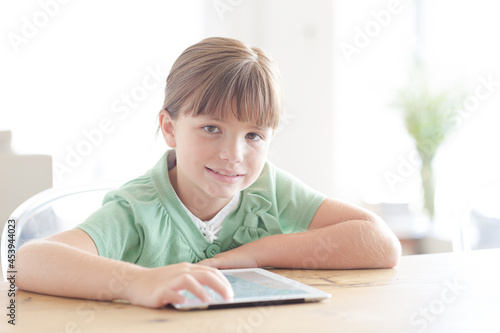 Girl with tablet computer, smiling
