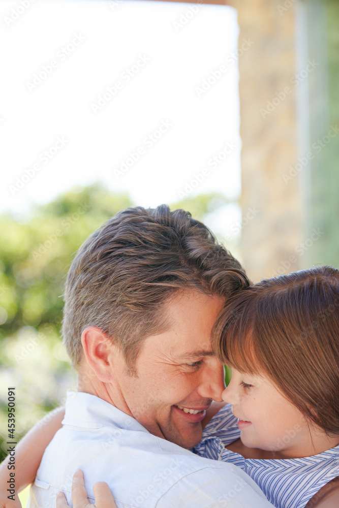 Father and daughter hugging outdoors Father and daughter hugging outdoors