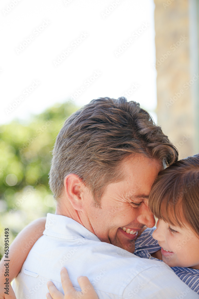 Father and daughter hugging outdoors Father and daughter hugging outdoors