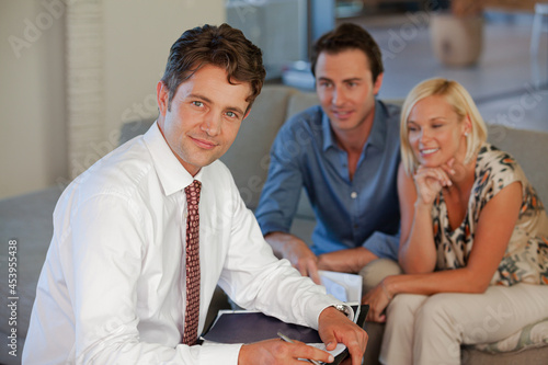 Financial advisor smiling with clients