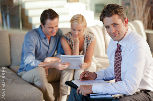 Financial advisor smiling with clients