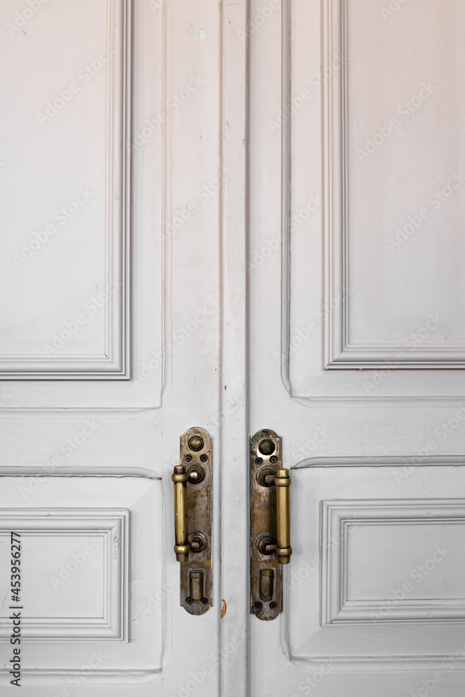 Modern white door with chrome door handle. New clean retro design Modern white door with chrome door handle. New clean retro design